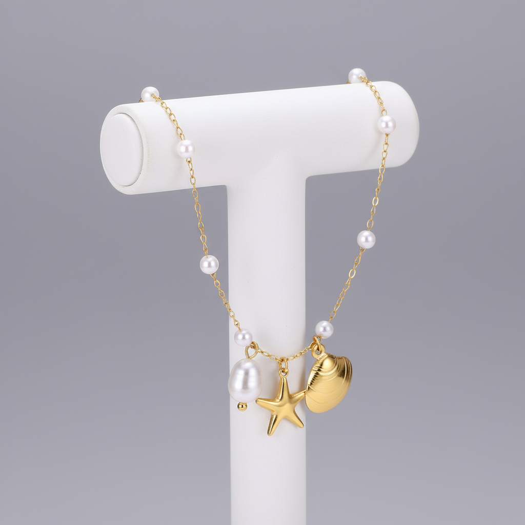 Beach-themed anklet on jewellery stand