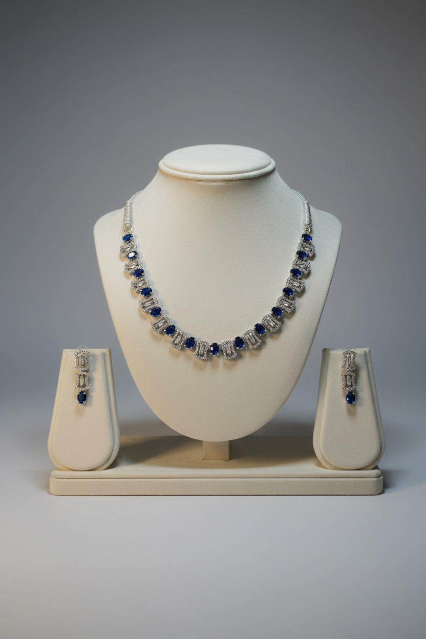 Blue sapphire and crystal jewellery set on display stand