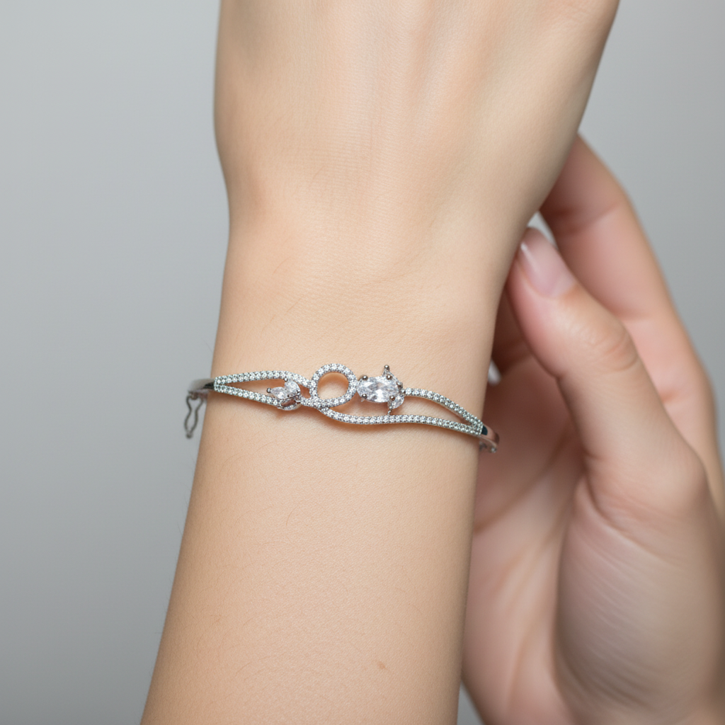 Model wearing crystal infinity bangle bracelet - close-up