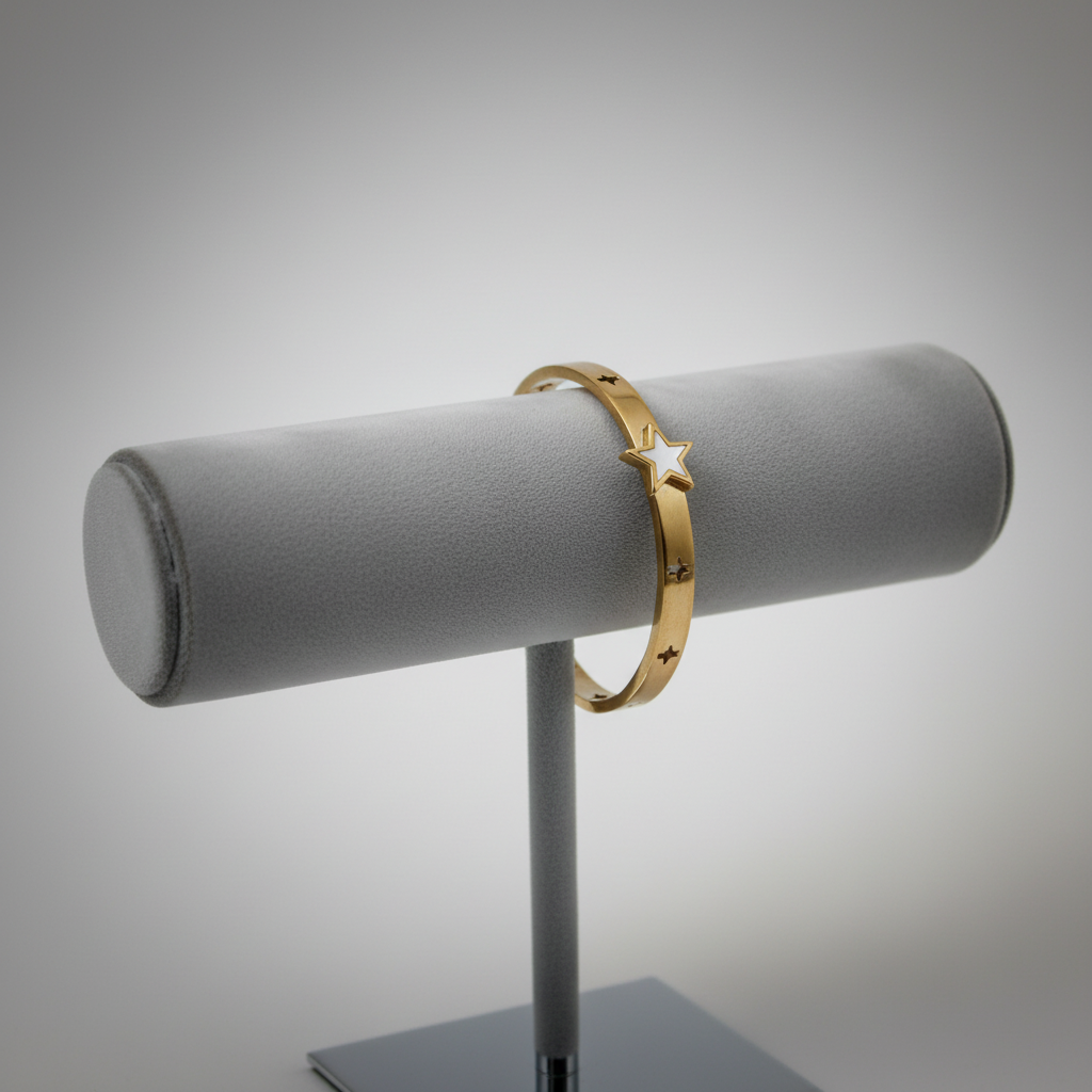 Gold star bangle bracelet on display stand