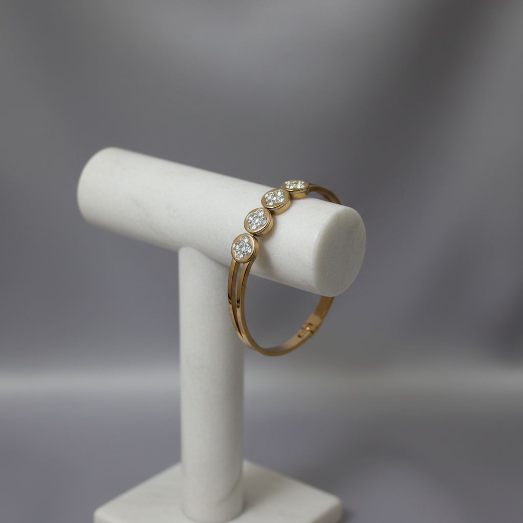 Gold crystal circle bangle bracelet on display stand