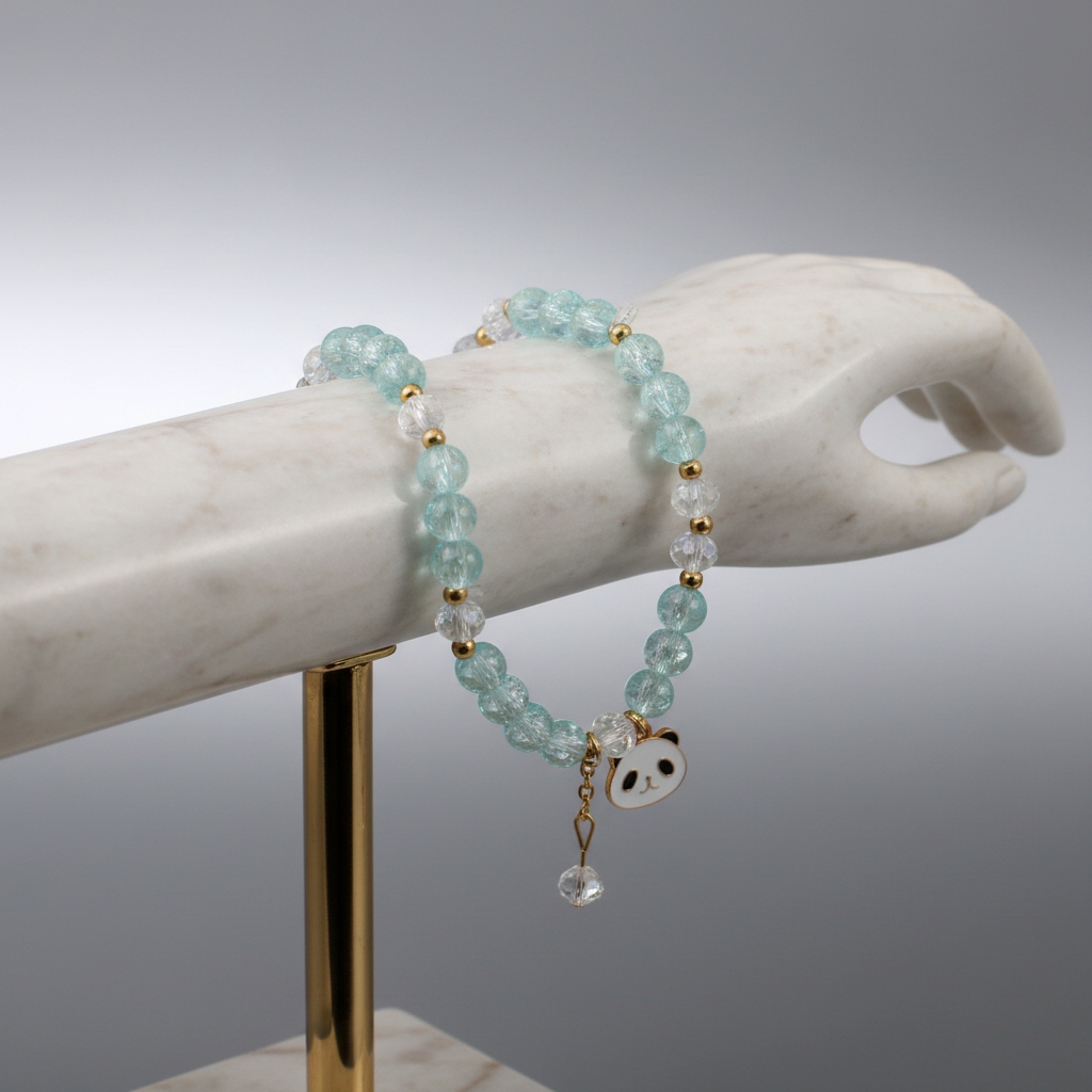 Aqua blue beaded bracelet with panda charm on display stand