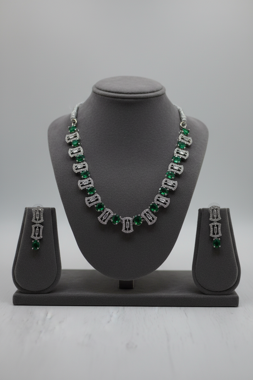 Emerald jewellery on display stand