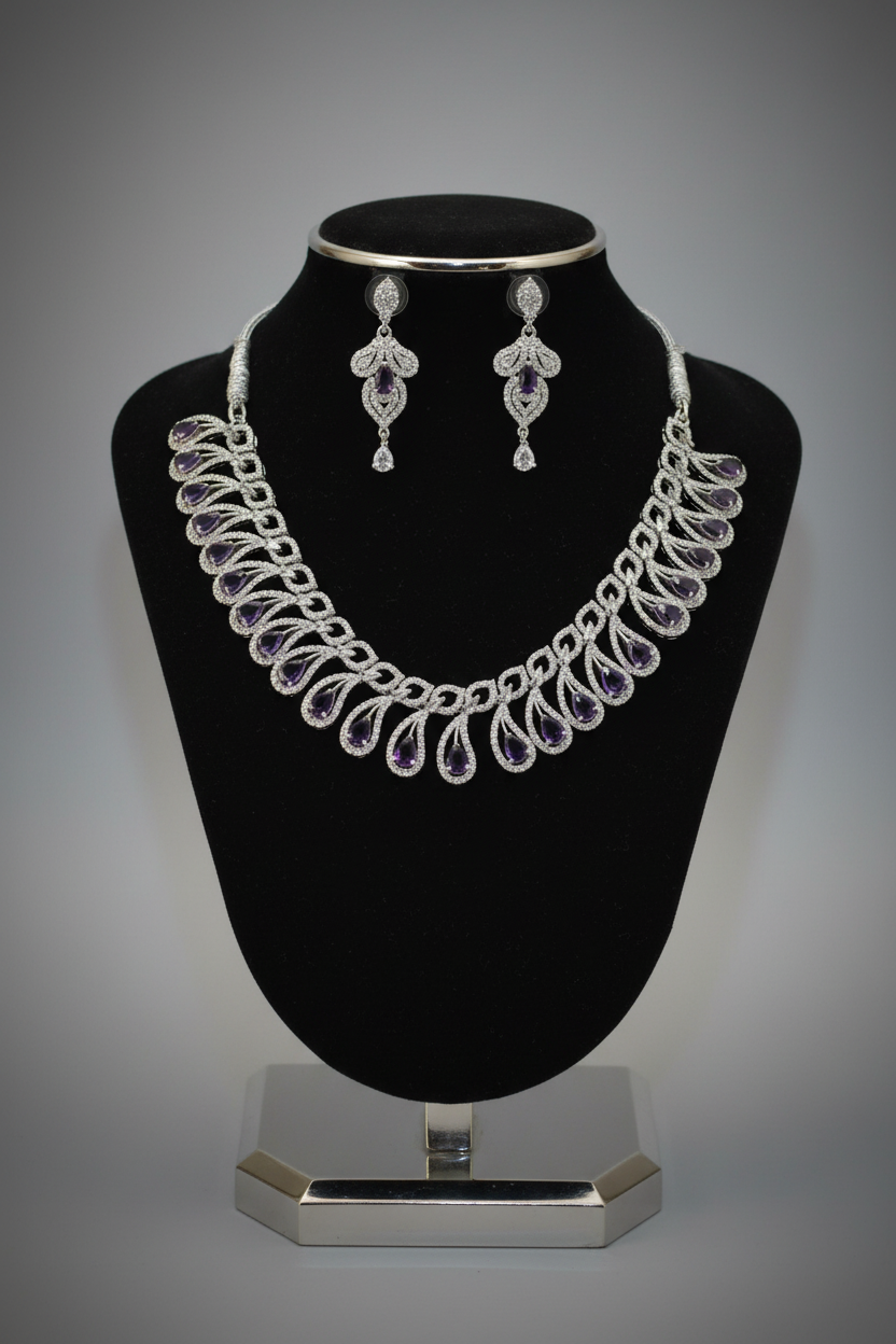 Purple amethyst teardrop jewellery set on display stand