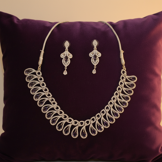 Purple amethyst teardrop jewellery set on velvet cushion