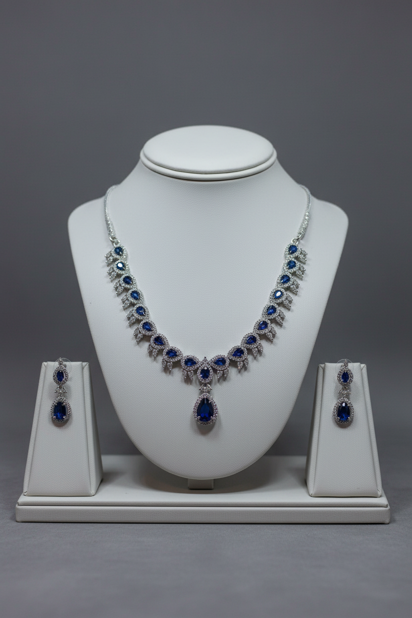 Blue sapphire necklace and earrings on jewellery stand
