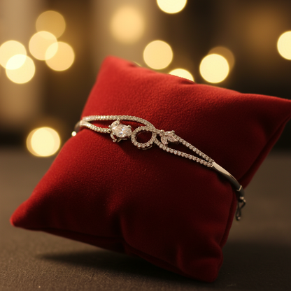Crystal infinity bangle bracelet on velvet cushion