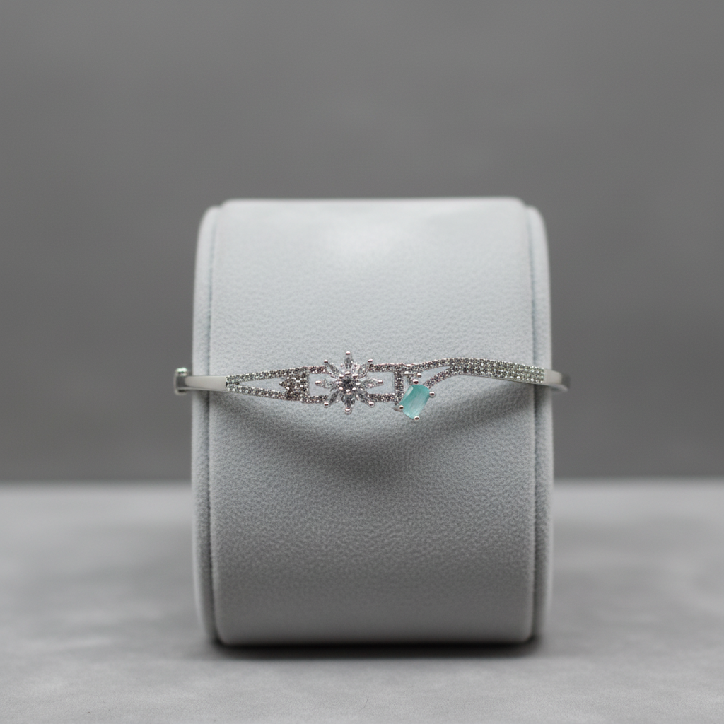 Crystal and turquoise bangle bracelet on display stand