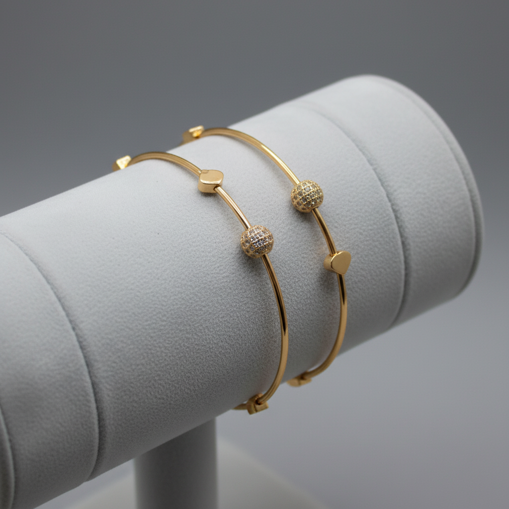 Gold bracelet set on display stand