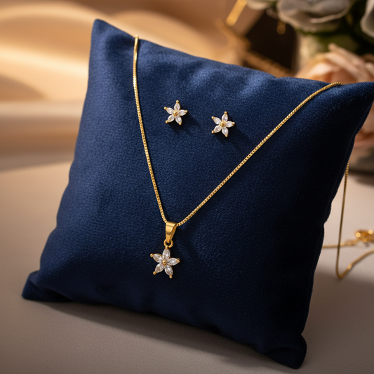Gold starfish jewellery set on velvet cushion
