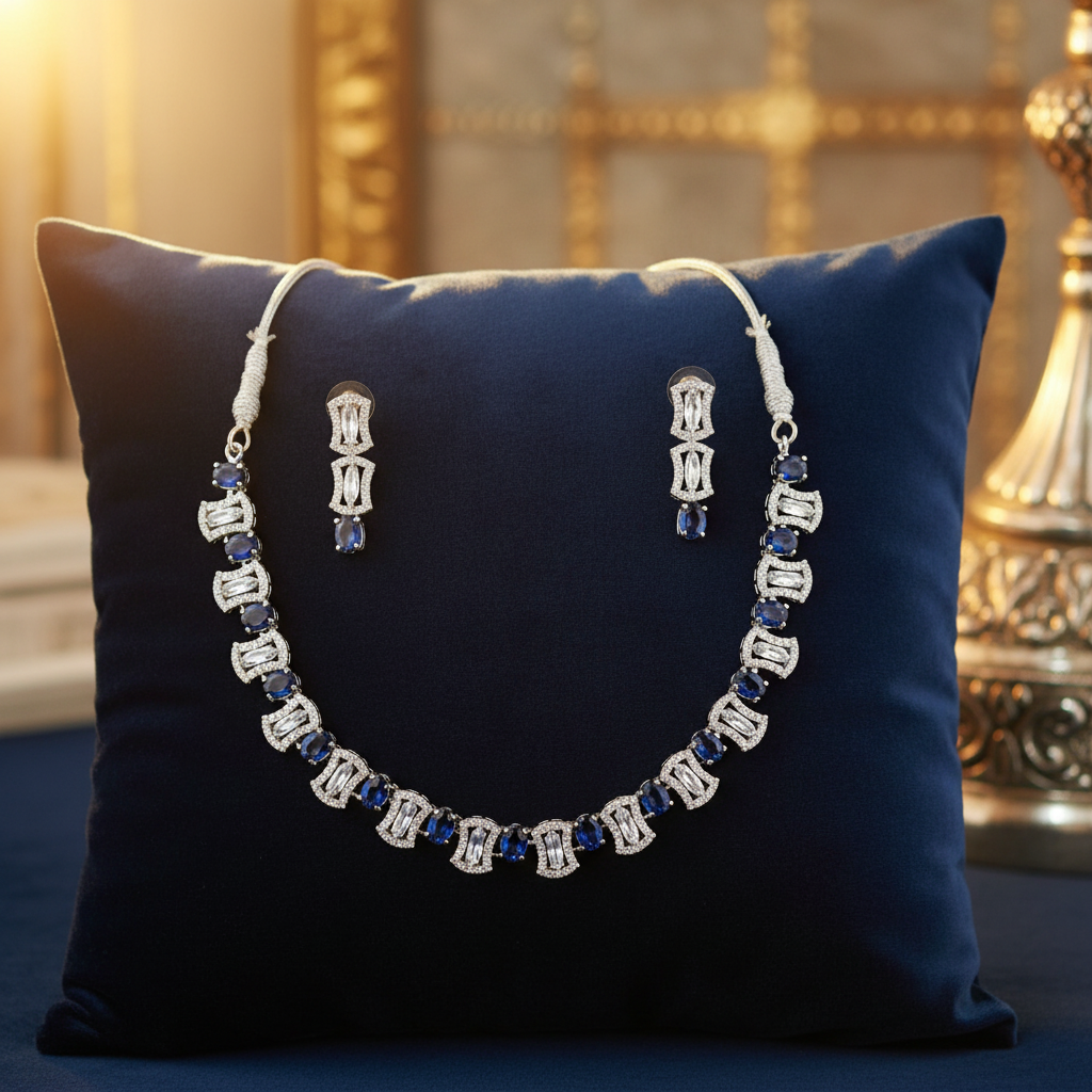 Blue sapphire and crystal jewellery set on velvet cushion