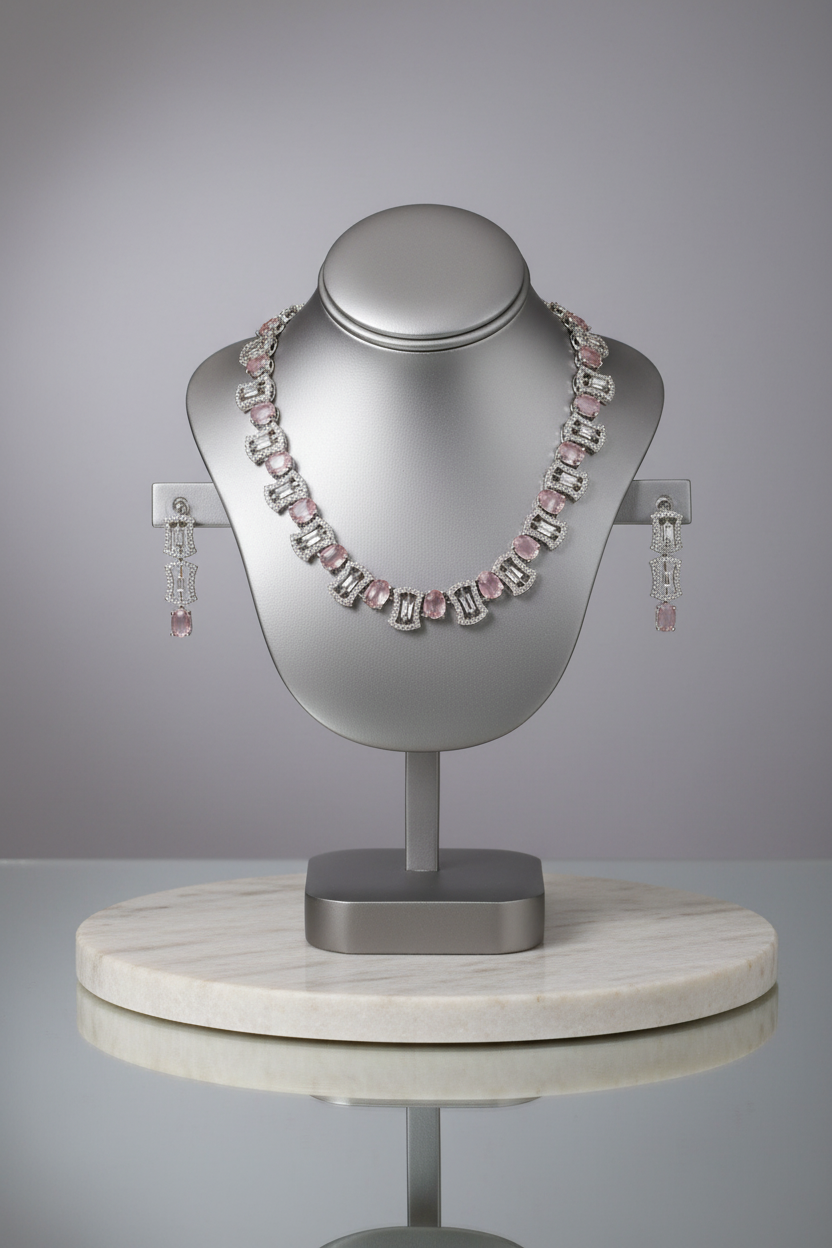 Pink gemstone jewellery set on display stand