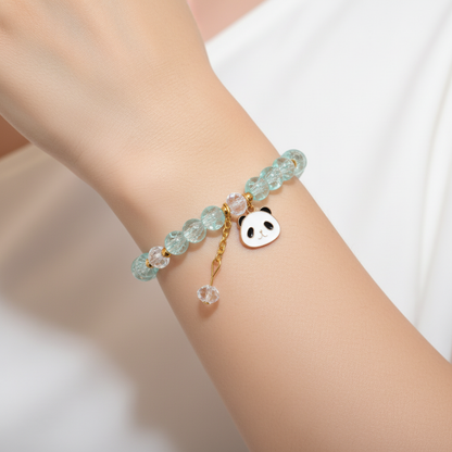 Model wearing aqua blue beaded bracelet with panda charm - close-up