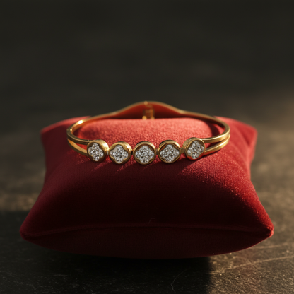 Gold crystal circle bangle bracelet on velvet cushion