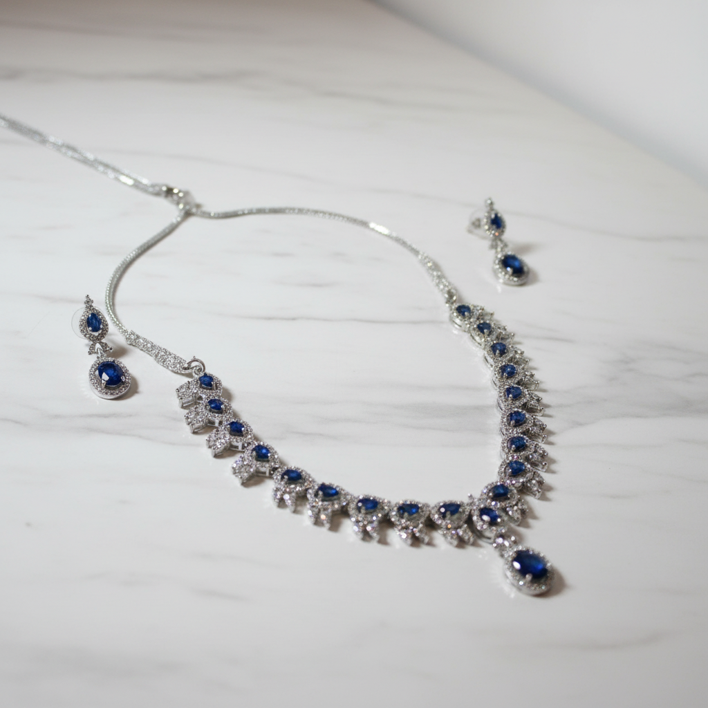 Blue sapphire jewellery set on marble surface