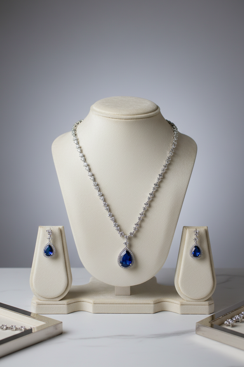 Blue sapphire pendant jewellery set on display stand