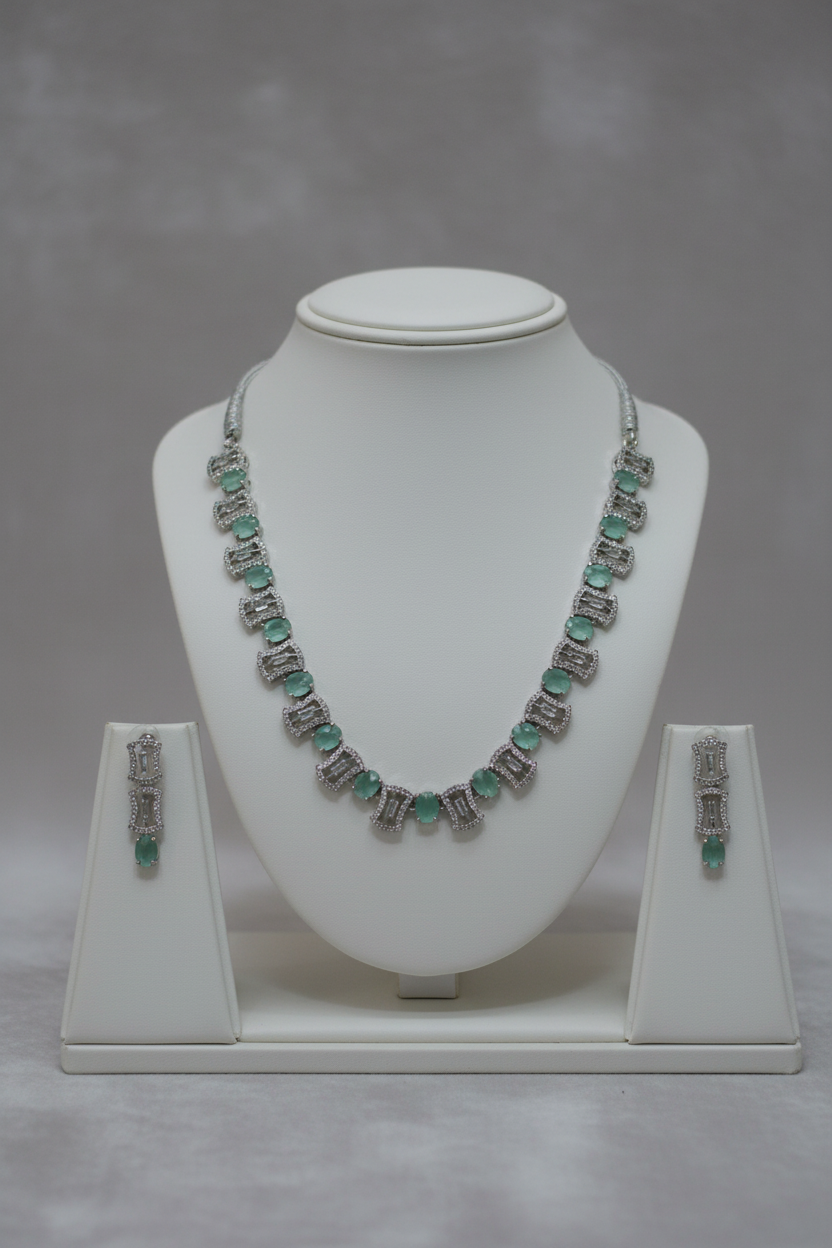 Mint green jewellery set on display stand