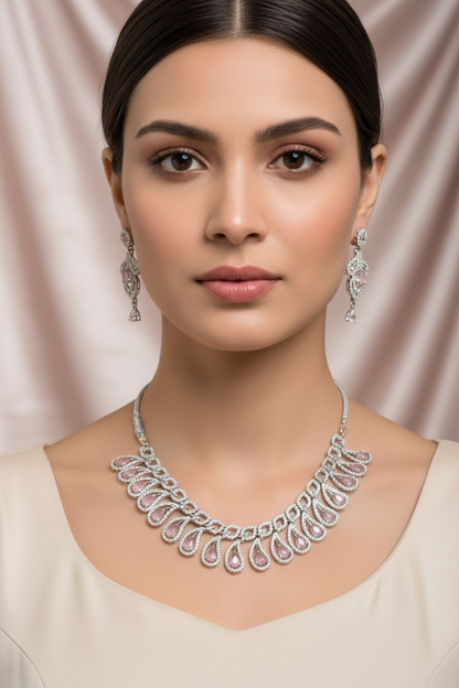 Model wearing pink gemstone teardrop jewellery set - close-up